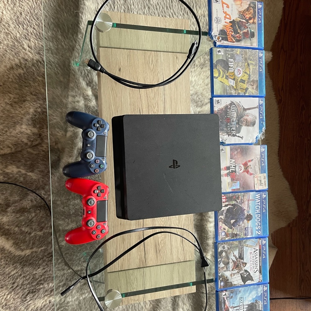 Used PlayStation 4 with cords, controllers, games!